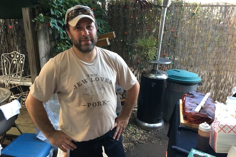 Michael Strauss of Mike’s BBQ selling barbecue outside El Bar in Kensington on Friday, July 7, 2017.