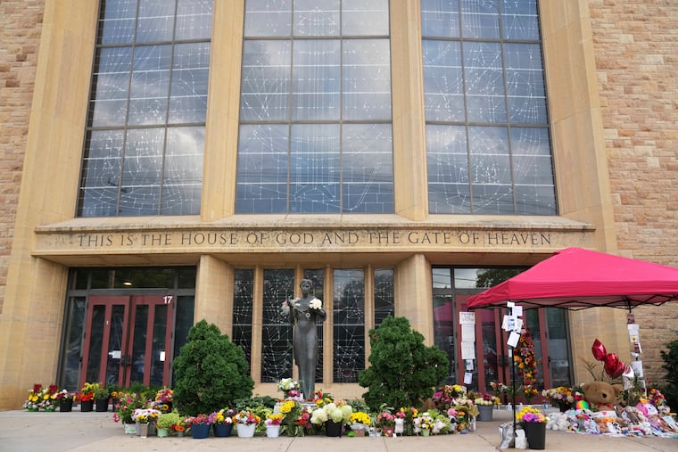 A memorial was set up outside Annunciation Catholic Church in Minneapolis after Wednesday's shooting.