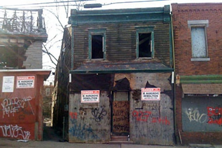 A house that the Camden Churches Organized for People is trying to get demolished. (Matt Katz / For the Inquirer)