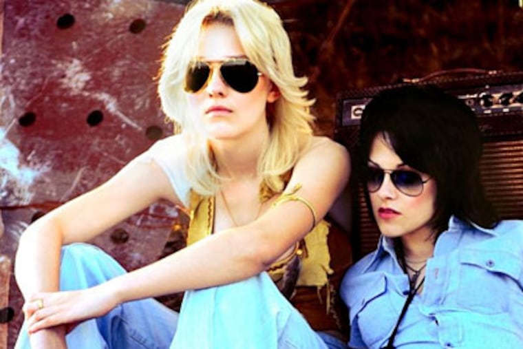 Kristen Stewart (right) as Joan Jett, with Dakota Fanning as Cherie Currie in "The Runaways."