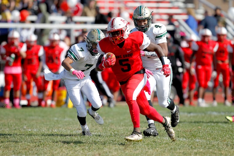 Penns Grove's Nasir Robinson runs for one of his three touchdowns in Saturday's 36-8 win over Schalick, the Red Devils' 20th victory in a row.