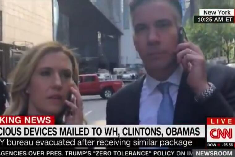 CNN anchors Poppy Harlow and Jim Shiutto were forced off the set mid-show, and have been reporting from the street after a suspected explosive device was found in the network's offices in New York City.