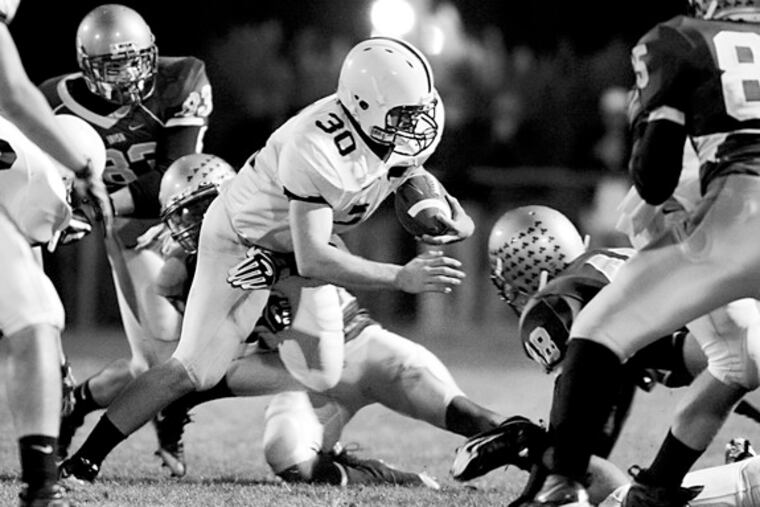 Shawnee's Chris LaPierre picks up yardage against Cherokee on Sept. 12. His next touchdown will make him the state's all-time TD scorer for one season, with 41. He is also just six points away from the state record for most points in a season, 254.