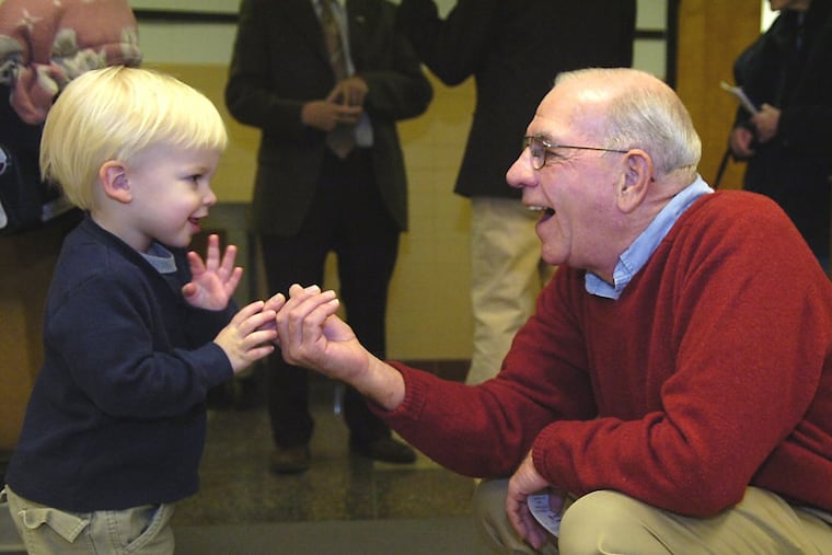 Then-Congressman Jim Saxton chats up a young constituent at the polls on Election Day in 2006.