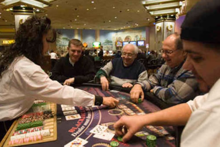 A blackjack dealer at work at Caesars Atlantic City. If table games are approved in Pennsylvania, a state senator estimates more than 10,000 jobs would be created, including dealers, pit bosses, and security - also creating a mighty task for the state Gaming Control Board and casino operators.