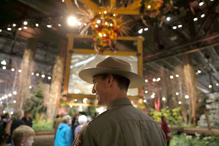 National Parks Service employee Brett Raeburn greets visitors during the members day at the Philadelphia Flower Show.