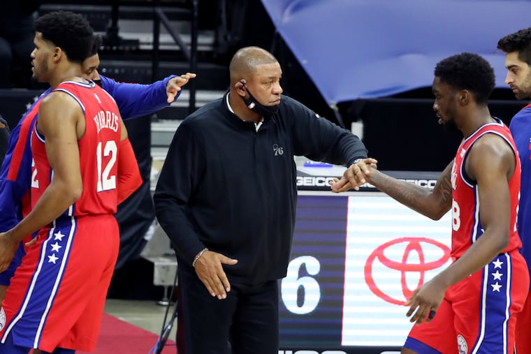Sixers coach Doc Rivers greets Shake Milton in the fourth quarter on Wednesday against the Wizards.