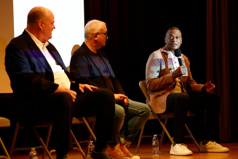 Richard Allen Jr. (right) speaks after a screening of "My Father, Dick Allen," a documentary on the life and legacy of Phillies legend and Hall of Fame baseball player Dick Allen, at the Parkway Central Library on Thursday.