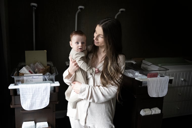 Meghan Gallagher holds her baby, Rhys, at the Shoshana, a new postpartum retreat located at the Logan Hotel.