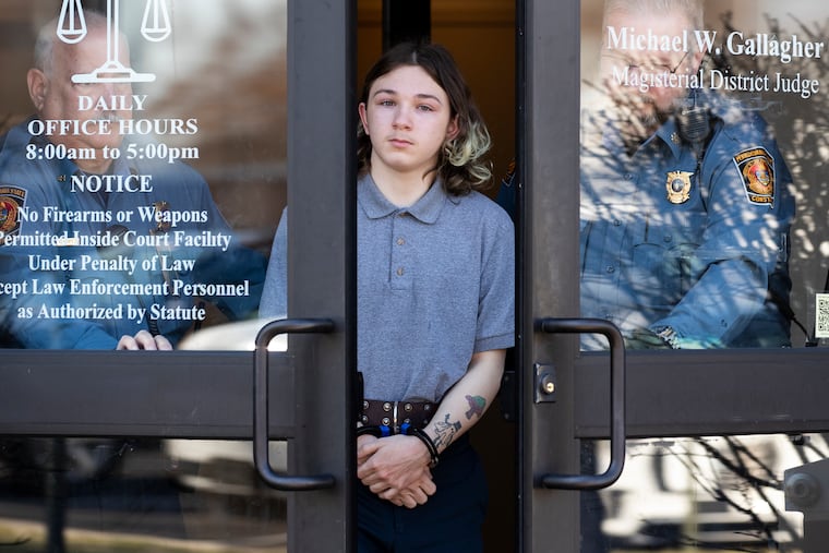 Ash Cooper leaves the District Court in Bensalem on March 6.