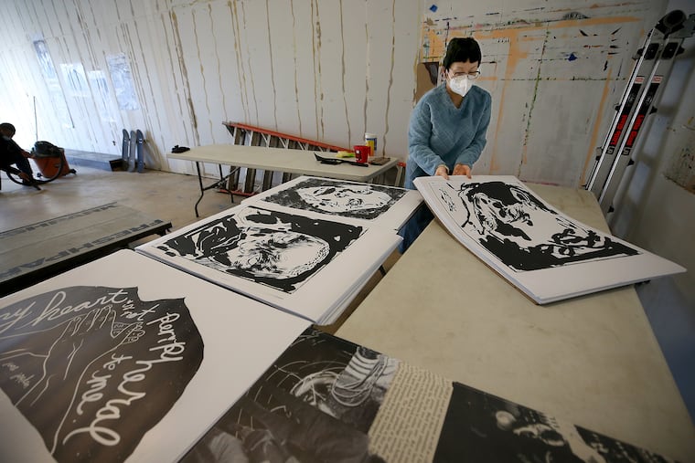 Anne Ishii, director of the Asian Arts Initiative, organizes the space for the 1223 Vine Skate Park & Wheatpaste Gallery as part of "Unity at the Initiative" exhibition to celebrate celebrating the city's trans and gay artists of color on February 4, 2021. Ishii's work this month has also included responding to anti-Asian hostility and discrimination in the Philly region.