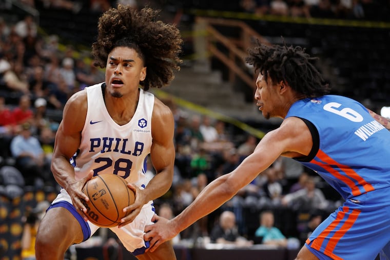 76ers forward Malik Ellison driving past Oklahoma City Thunder forward Jaylin Williams during a summer league game on July 7.