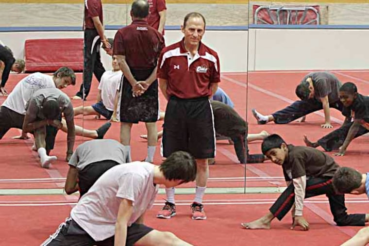 Fred Turoff, a coach at Temple for more than 40 years and A former student, runs the Philadelphia Boys Gymnastics club, Monday, December 16, 2013. ( Steven M. Falk / Staff Photographer )