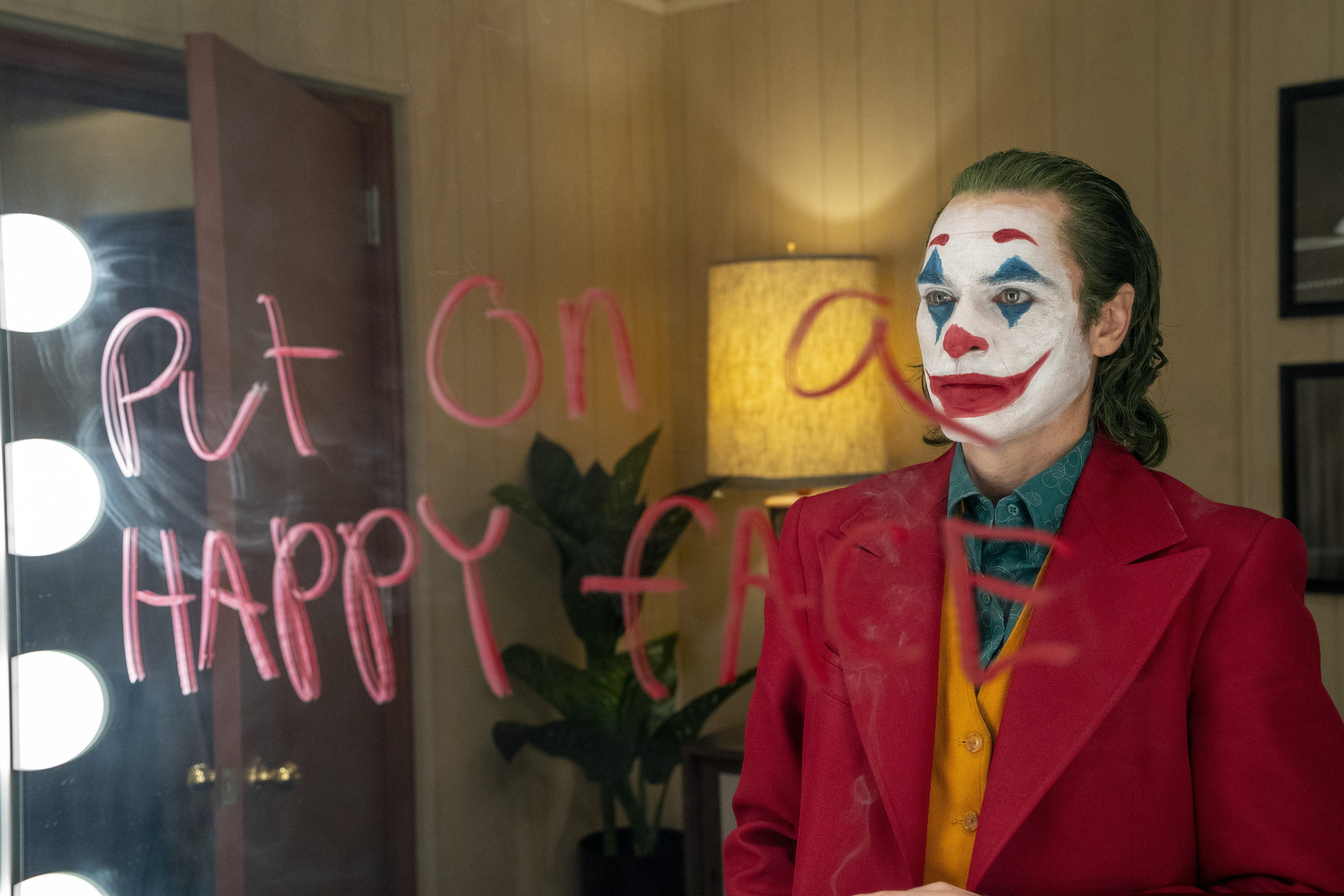 This image released by Warner Bros. Pictures shows Joaquin Phoenix in a scene from the film, "Joker."