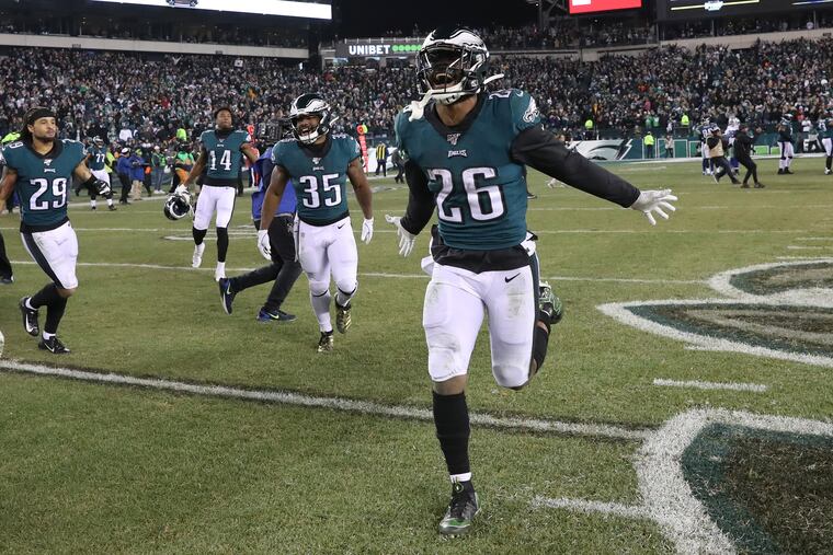 Eagles running back Miles Sanders (26) celebrates after beating the Cowboys on Sunday.