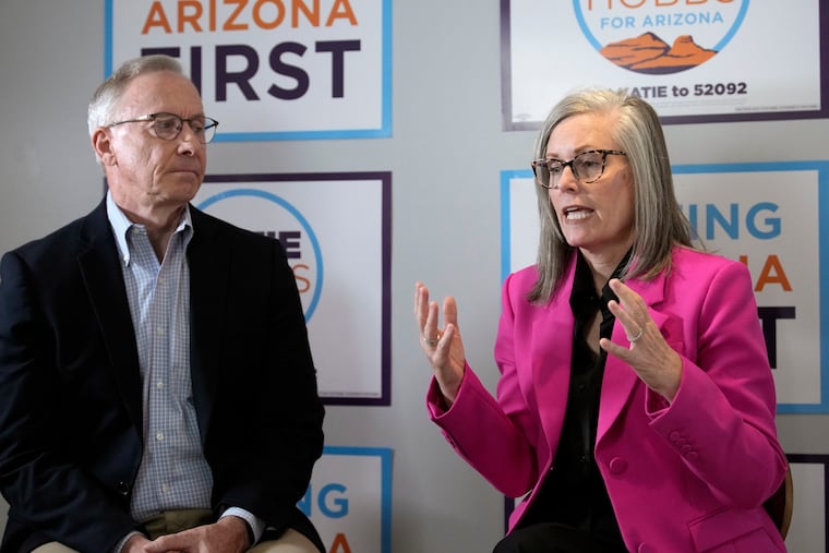Arizona Democratic Gov. Katie Hobbs (right) sits down with her running mate for lieutenant governor, John Giles, the former Republican Mesa, Ariz., mayor, Monday, Aug. 10, 2026, in Phoenix.