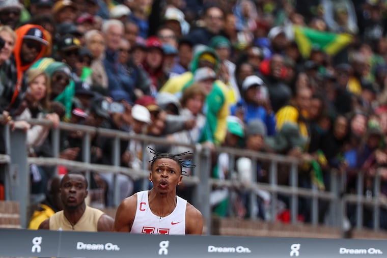Houston's Shaun Maswanganyi reacts after crossing the finish line in the college men's 4x100 Championship of America at the Penn Relays on Saturday.
