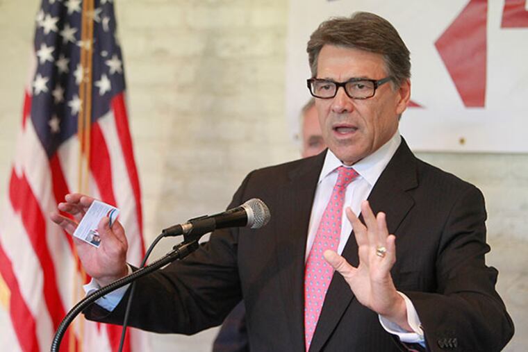 Texas Gov. Rick Perry (pictured) and a US Senate hopeful Steve Lonegan held a town-hall meeting at the Smithville Inn in Smithville, NJ on Tuesday, October 1, 2013. (AKIRA SUWA / Staff Photographer)