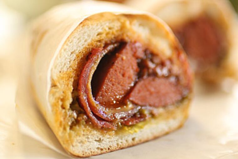 The Tuscan Tony sandwich at Paesano's. Just when you thought chains were destroying the flavor of the sandwich, we get the Tuscan Tony, and, the Viet House Special, among others. (Michael Bryant/Inquirer)