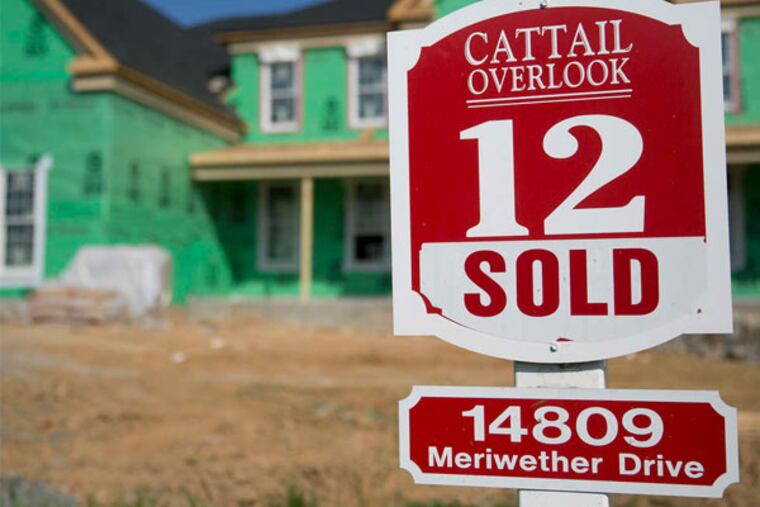 A "sold" sign at a house under construction earlier this year at the Toll Bros. Inc. Cattail Overlook development in Glenelg, Md. ANDREW HARRER / Bloomberg News