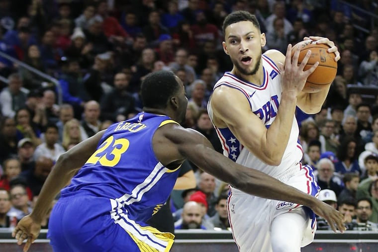 Ben Simmons, here driving past Warriors forward Draymond Green, is putting up impressive numbers through 16 games.