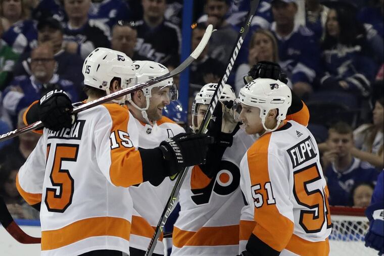 Flyers winger Jori Lehtera (left) celebrating with his teammates after scoring a goal in a recent game in Tampa.