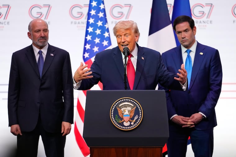 President Donald Trump is flanked by Secretary of Commerce Howard Lutnick (left) and Secretary of State Marco Rubio during a news conference Wednesday at the end of the G7 summit in Evian-les-Bains, France.