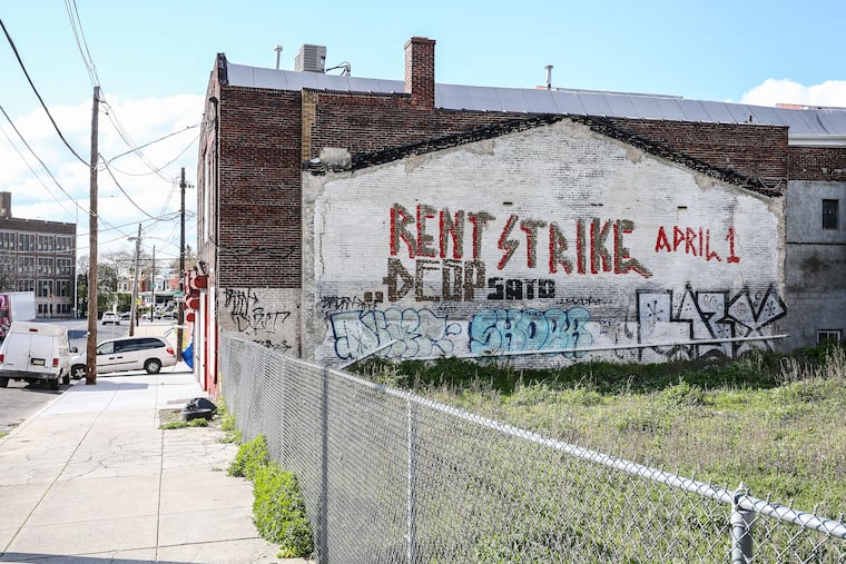 Graffiti at 53rd and Whitby in West Philadelphia calls for a rent strike. Tenants across the city are organizing, some demanding landlords and management firms provide building-wide rent reductions and forgiveness.