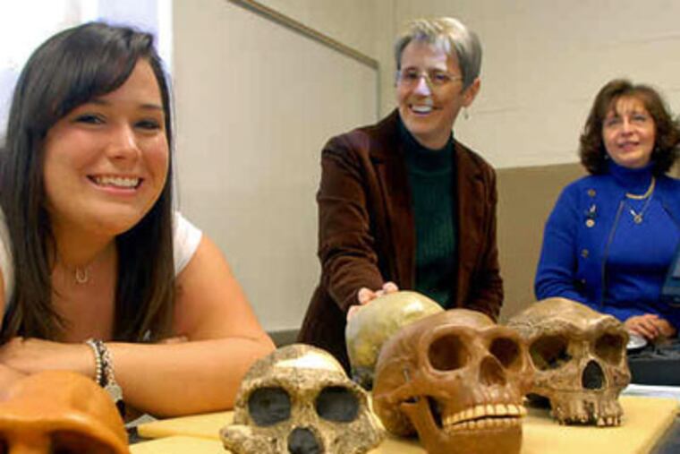Who's your daddy's daddy's daddy's daddy's . . . ? At Rowan University, (from left) Danielle Christal, Patricia Mosto and Maria Rosado took part in genographic testing. (Tom Gralish / Staff Photographer)