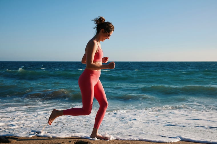 Natalie Burtney works out at Point Dume State Beach in Malibu, Calif. The beach can be a playground for adults and allow you to move in new and different ways, which can bring fitness benefits you can’t usually get in a gym.