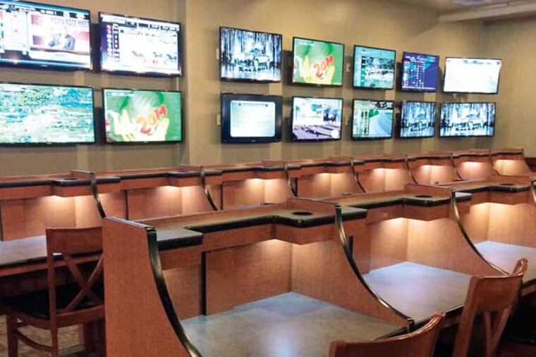 The Favorites off-track betting facility has 130 flat-screen TVs. It opened Tuesday in Clementon. Photo by Michael Boren.