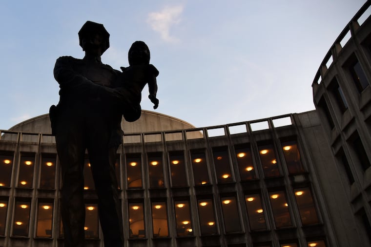 The iconic "A Friend" statue by Wilmington, Del., artist Charles Cropper Parks outside the Philadelphia Police Administration Building at Race and Arch Streets.