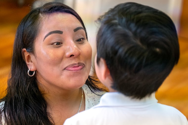 Andrea Lozano-Alanis is with her son after she is interviewed Tuesday in Norristown on Tuesday. She'd just been released from about three weeks in county jail and ICE detention, held initially over a $77 bail, and still faces deportation to Mexico.