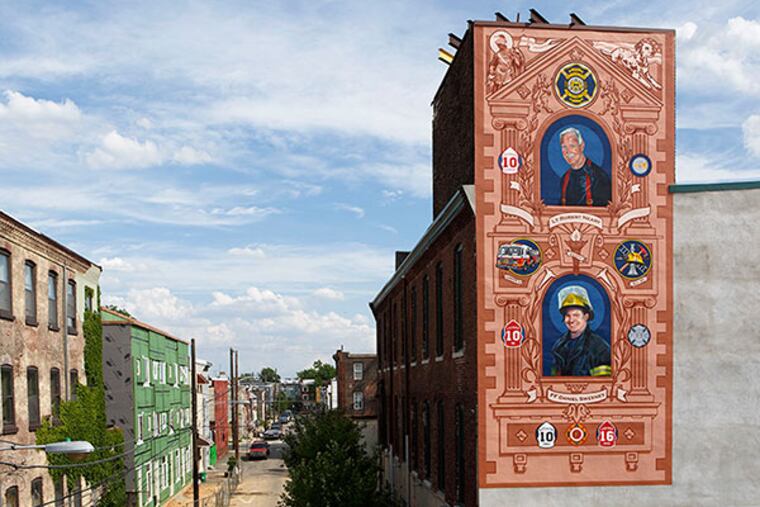 Jesse Gardner painted this East Kensington mural of of firefighters Robert Neary and Daniel Sweeney, killed in the 2012 Buck Hosiery warehouse fire. (Steve Weinik / FOR THE DAILY NEWS)
