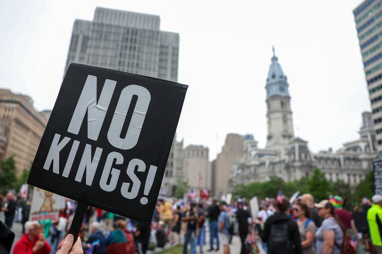 People gather in Love Park for the “No Kings” protest on Saturday.