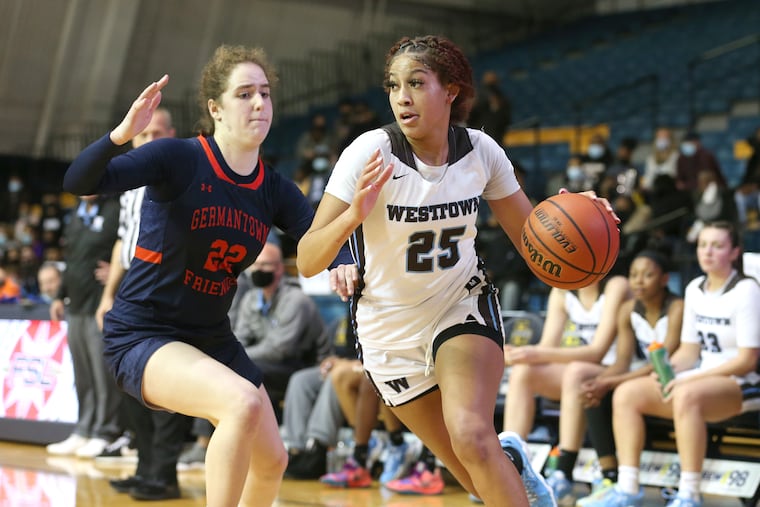 Westtown girls basketball player Kaylene Smikle is one of the top girls' players in the country in the senior class, and she will play college basketball for Rutgers. She is shown during the Friends Schools League Basketball Championships driving against Martina Kiewek of Germantown Friends on Feb. 18.
