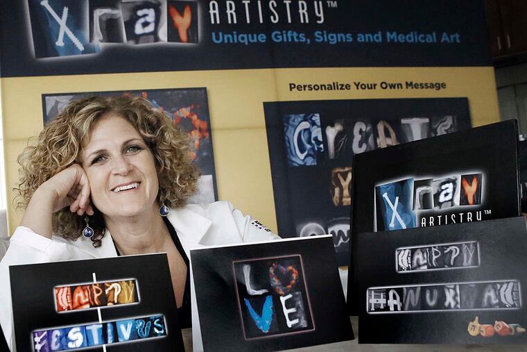 Radiologist Sue Summerton with examples of her art, based on X-rays and ultrasound images re-created by a graphic designer.