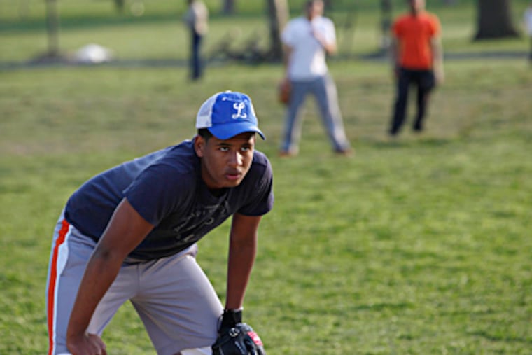 Julian Aponte, 17, practices with the Hunting Park Indians. Thanks to a cooperative effort involving Ryan Howard, the team will get a new, world-class field on Friday. MICHAEL S. WIRTZ / Staff Photographer