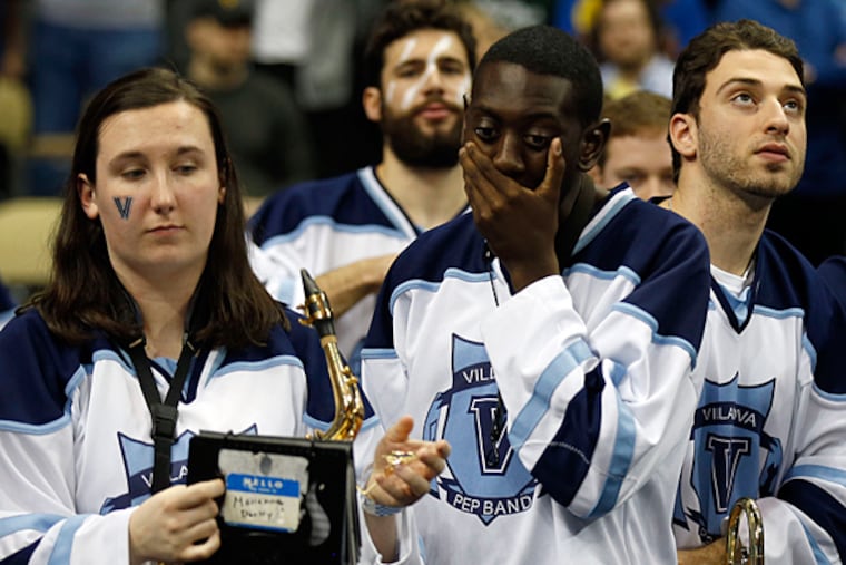 Villanova band members stand dejected after the basketball team lost
to North Carolina State. (Yong Kim/Staff Photographer)