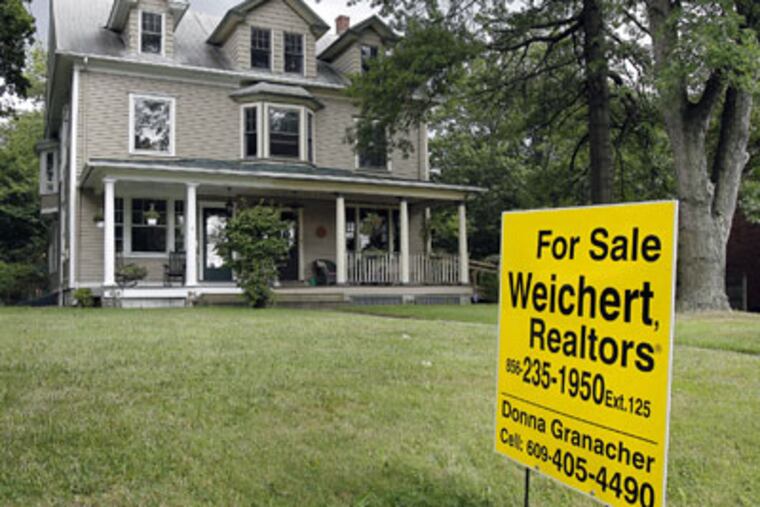 A house for sale along Kings Highway in Haddonfield. In the eight-county area, existing-home sales were off 2.75 percent. Because the local market has not seen the big declines experienced elsewhere, it is unlikely to see big increases ahead. Prices also seem to be stabilizing, the report said. (Akira Suwa / Staff Photographer)
