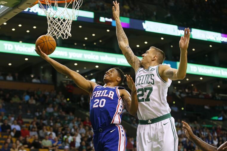 Markelle Fultz goes to the basket past the Celtics' Daniel Theis (27) during the first quarter Monday.
