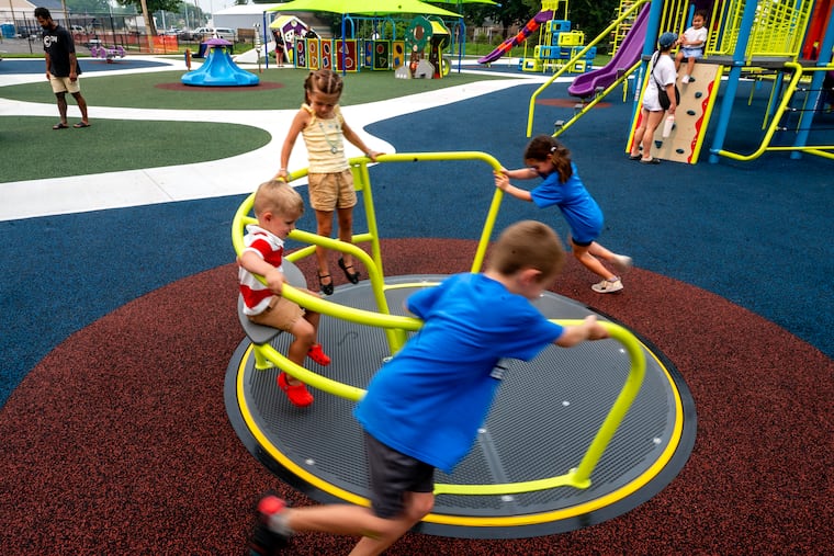 Clockwise from top, Lilly, 4, Delaney, 5, Nicholas 7, and Carter, 2, play in the newly-opened Finn's Friends Park in Williamstown on Thursday, July 16, 2026.