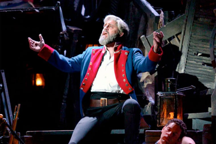 Peter Lockyer as ex-convict Jean Valjean, stalked by the relentless police officer Javert. The touring show continues here till Jan. 13.