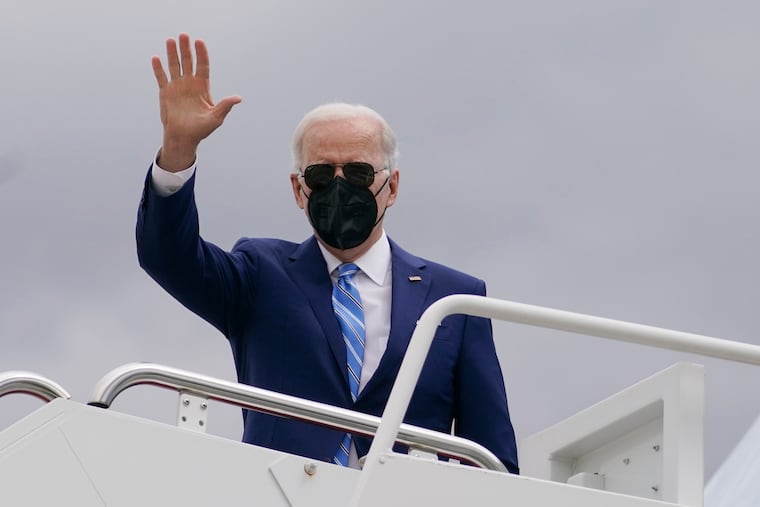 President Joe Biden boards Air Force One in Andrews Air Force Base, Md., on Tuesday en route to Menlo, Iowa.
