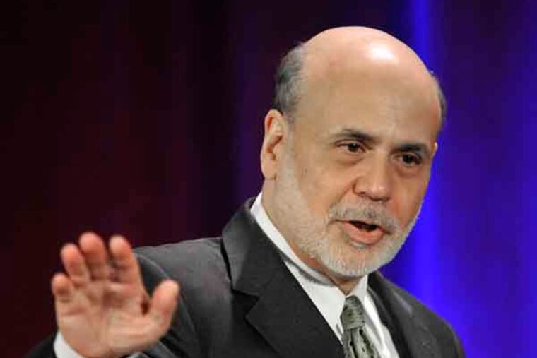 Federal Reserve Chairman Ben Bernanke waves goodbye after speaking during a banking conference in Chicago, Friday, May 10, 2013. The Federal Reserve has broadened its oversight beyond banks and now monitors a wide-range of financial institutions that could hasten another financial crisis, Bernanke said Friday. (AP Photo/Paul Beaty)