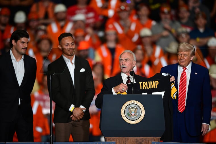 Pittsburgh Steelers quarterback Mason Rudolph, Pittsburgh Steelers Miles Killebrew, former Pittsburgh Steelers Rocky Bleier, join President Donald Trump on stage as they present him a Pittsburgh Steelers jersey at the U.S. Steel Mon Valley Works-Irvin plant, Friday, May 30, 2025, in West Mifflin, Pa. (AP Photo/David Dermer)