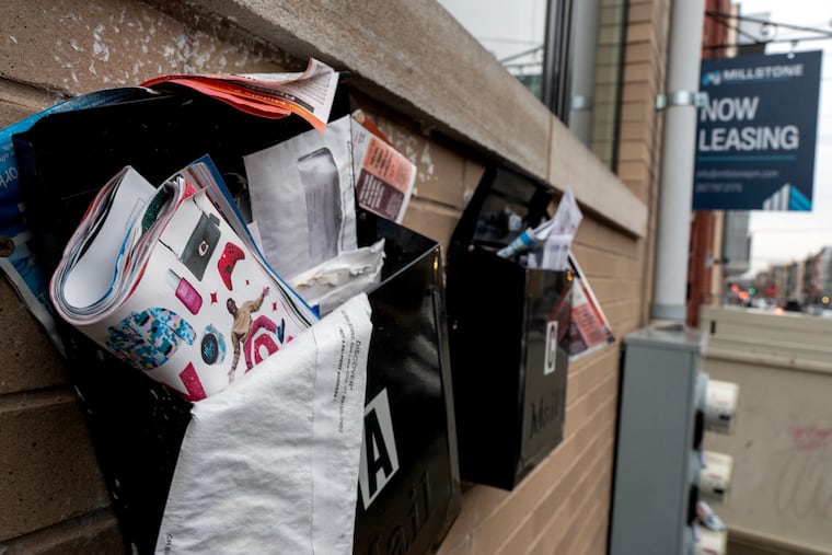 Mail piles up at homes on the 1800 block of N. 18th St in North Philadelphia on Wednesday, Dec. 10, 2025. Buyers have snapped up more than $40 million in student housing around Temple University, often paying more than twice what properties were originally listed for, even though rents are down and vacancies are up.
