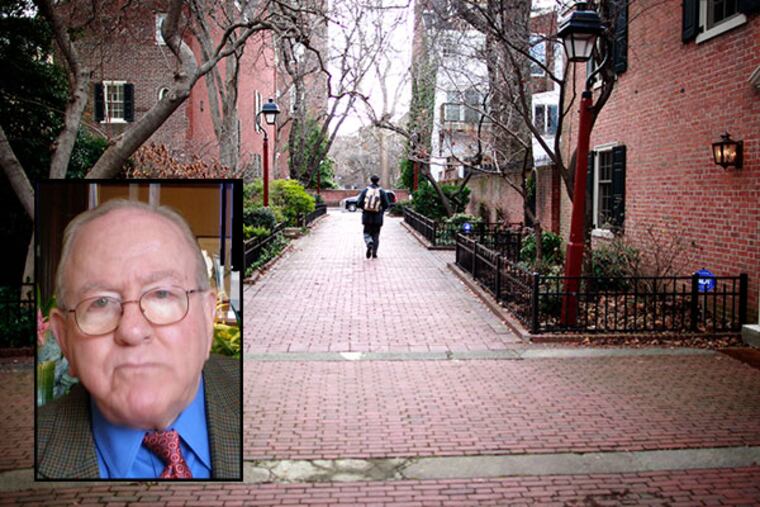 A pedestrian walks south on St. Peter's Way, helped with the design and funding by Jason R. Nathan (bottom right), 84, who died. ( DAVID SWANSON / Staff Photographer )