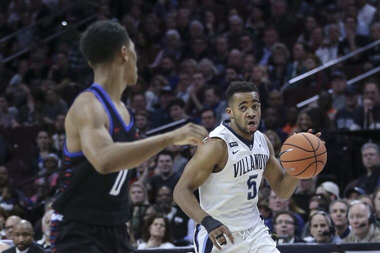 Villanova’s Phil Booth drives against DePaul’s Justin Roberts during the first half of the Wildcats’ win on Wednesday.