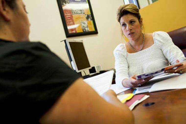 Marlene Santiago works at the Neighborhood Housing Services as a Neighborworks Certified Foreclosure Intervention Counselor in San Jose, California, May 29, 2009. Santiago works with people going through the foreclosure process as they attempt to keep their homes or find other options. (Paul Myers / San Jose Mercury News / MCT)